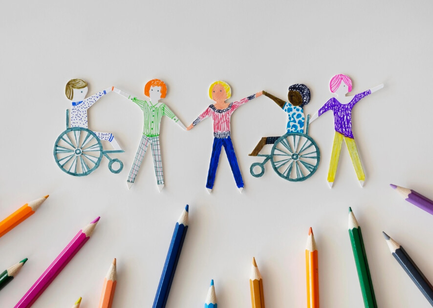 Multi ethnic disabled people community with pencils