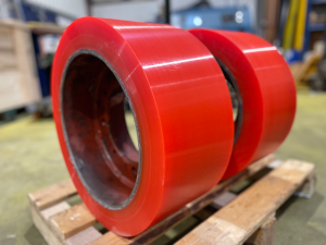 Custom-colored technical PU elastomer components being manufactured at ENRI's production facility.